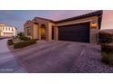 Well-maintained single-story home with neutral colors, desert landscaping, and an attached two-car garage at 10309 E Supernova Dr, Mesa, AZ 85212
