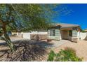 Home exterior with desert landscaping, stone accents, and a welcoming front entrance at 16410 W Monte Cristo Ave, Surprise, AZ 85388