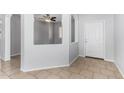 Bright entryway features tile flooring, neutral paint, and an arched niche at 16848 W Bradford Way, Surprise, AZ 85374