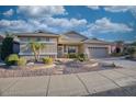 Inviting single-story home with manicured desert landscaping and ample parking at 17675 N Coconino Dr, Surprise, AZ 85374