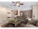 Open-concept living room with neutral tones, modern decor, and ample seating at 2600 E Springfield Pl # 61, Chandler, AZ 85286