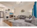 Bright living room with a large sectional sofa, custom wall niches, and stylish decor at 2662 S Iowa St, Chandler, AZ 85286