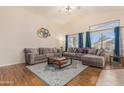 Spacious living room with vaulted ceilings, hardwood floors, and comfortable seating at 2662 S Iowa St, Chandler, AZ 85286
