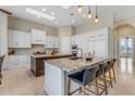 Gourmet kitchen with marble countertops, twin islands, and stainless steel appliances at 6938 E Lomas Verdes Dr, Scottsdale, AZ 85266