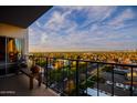 A balcony with seating provides picturesque city views at 805 N 4Th Ave # 903, Phoenix, AZ 85003