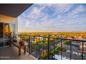 A balcony with seating provides picturesque city views at 805 N 4Th Ave # 903, Phoenix, AZ 85003