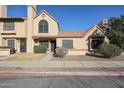 Exterior view of a two-story home with a red tile roof and desert landscaping at 921 W University Dr # 1099, Mesa, AZ 85201