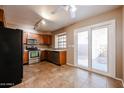 Bright kitchen with stainless appliances and a large sliding glass door at 921 W University Dr # 1099, Mesa, AZ 85201