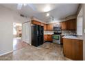 Kitchen featuring wood cabinets and stainless steel appliances at 921 W University Dr # 1099, Mesa, AZ 85201