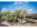 Desert home with mature trees in a low water xeriscape yard at 11199 E Prospect Point Dr, Scottsdale, AZ 85262