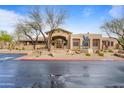 Beautiful community clubhouse featuring unique bronze statue and covered entryway at 11500 E Cochise Dr # 2067, Scottsdale, AZ 85259