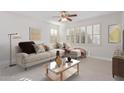 Inviting living room features a plush sectional sofa and a decorative coffee table at 17816 W Mariposa Dr, Surprise, AZ 85374