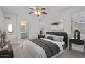 Serene main bedroom with an ensuite bathroom and ample natural light at 17816 W Mariposa Dr, Surprise, AZ 85374