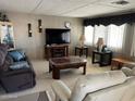 Inviting living room with comfortable seating and a large window providing ample natural light for a relaxed atmosphere at 2207 N Shannon Way, Mesa, AZ 85215