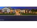 Charming home featuring manicured lawn, stone walkway and warm exterior lighting at 2656 E Oriole Dr, Gilbert, AZ 85297