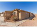 Charming single-story home showcasing low maintenance desert landscaping at 35344 N Karan Swiss Cir, San Tan Valley, AZ 85143