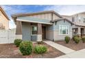 Well-kept home with a welcoming front porch, coordinating color scheme, and carefully manicured landscaping at 3868 E Robert St, Gilbert, AZ 85295
