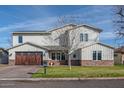 Charming two-story home boasts brick accents, a well-maintained lawn, and a welcoming two-car garage at 4306 E Flower St, Phoenix, AZ 85018