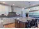 Bright kitchen featuring a center island, stainless steel appliances, and ample cabinet space at 4306 E Flower St, Phoenix, AZ 85018
