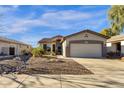 Single-Gathering home with desert landscaping and an attached two car garage at 4327 E Walnut Rd, Gilbert, AZ 85298