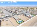 Expansive aerial view showcasing the home's private pool and meticulously landscaped yard within the community at 4507 E Warlander Ln, San Tan Valley, AZ 85140