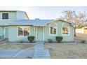 Charming exterior with light green siding, manicured bushes, and tidy landscaping at 4731 N 26Th Ln, Phoenix, AZ 85017