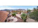 Enjoy mountain views from the backyard with a patio and desert landscaping at 6353 S Eagle Ct, Gold Canyon, AZ 85118