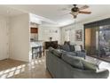 Bright living room featuring a large sectional sofa, tile floors, and an open layout at 705 W Queen Creek Rd # 1157, Chandler, AZ 85248