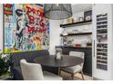 Dining area with unique art, a modern table, and a built-in wine cooler at 7167 E Rancho Vista Dr # 3002, Scottsdale, AZ 85251