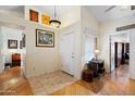 Bright foyer with hardwood flooring, decorative accents, and high ceilings, offering an inviting entrance to the home at 8736 W Kathleen Rd, Peoria, AZ 85382