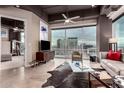 Modern living room with floor-to-ceiling windows offering stunning city views and ample natural light at 1 E Lexington Ave # 1210, Phoenix, AZ 85012