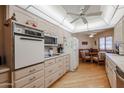 Bright kitchen featuring wooden floors, and updated appliances at 10461 W Loma Blanca Dr, Sun City, AZ 85351