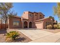 Beautiful two-story home with a tile roof, spacious driveway, and well-maintained landscaping at 10684 N 161St Ave, Surprise, AZ 85379