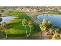 Aerial view showcasing the pristine golf course, lakes, and manicured lawns at 11530 E Monterey Ave, Mesa, AZ 85209