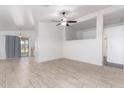 Open concept living area featuring tile floors, and neutral paint at 14946 W Caribbean Ln, Surprise, AZ 85379