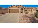 Single-story home featuring desert landscaping, two-car garage, and a neutral color scheme at 16150 W Hope Dr, Surprise, AZ 85379