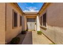 A welcoming entryway with double doors flanked by sidelight windows at 2422 W Aloe Vera Dr, Phoenix, AZ 85085