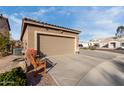 View of the large garage door with room for parking and seating on the side at 2528 E La Costa Dr, Chandler, AZ 85249