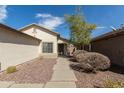 Charming single-story home with desert landscaping and a walkway to the front door at 30169 N Sunray Dr, San Tan Valley, AZ 85143