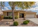 Charming single-story home featuring a well-maintained front yard and a two-car garage at 4033 S Harlan --, Mesa, AZ 85212