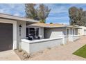 Attractive single-story home with a private front patio and drought-tolerant plants at 5412 E Tierra Buena Ln, Scottsdale, AZ 85254