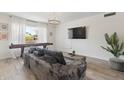 Cozy living room with a large sectional sofa and a view to the outdoors at 5412 E Tierra Buena Ln, Scottsdale, AZ 85254