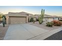 Spacious single Gathering home with wide driveway and desert landscaping at 5742 S Creosote Dr, Gold Canyon, AZ 85118