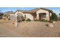 Attractive single-story home with desert landscaping and an arched entryway at 6516 W Matilda Ln, Glendale, AZ 85308