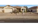 Inviting single-story home featuring desert landscaping and a covered front entry way at 6516 W Matilda Ln, Glendale, AZ 85308