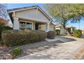 Attractive one-story home with desert landscaping, covered porch, and an attached two-car garage at 7924 S 24Th Pl, Phoenix, AZ 85042