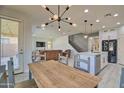 Open concept kitchen features an island with stylish accents, seamlessly flowing into the living area at 8966 W State Ave, Glendale, AZ 85305