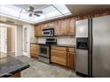 Traditional kitchen featuring stainless steel appliances, granite countertops, and tiled backsplash at 10218 W Forrester Dr, Sun City, AZ 85351