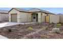 Front exterior showcasing desert landscaping surrounding the home at 12089 E Sunflower Ln, Florence, AZ 85132