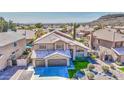 Beautiful two-story home with a three-car garage, lovely landscaping, and mountain views at 1349 E Rock Wren Rd, Phoenix, AZ 85048